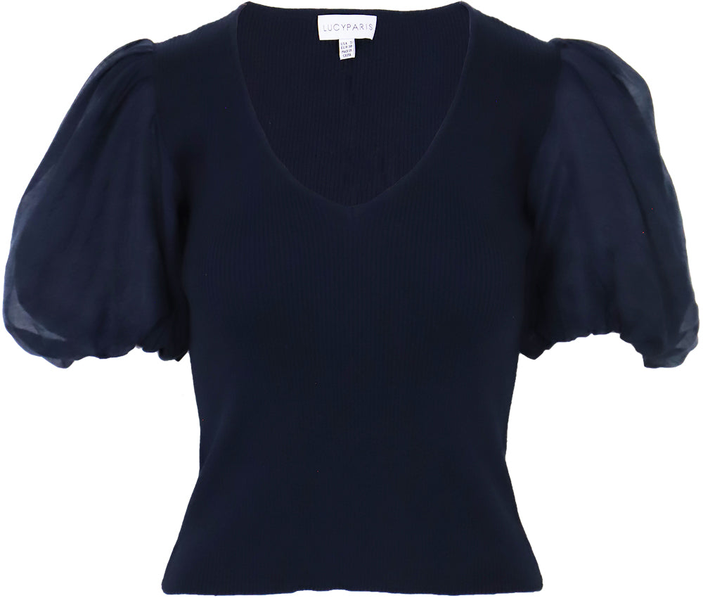 Chic navy blue top with a deep V-neckline and statement puff sleeves, featuring a ribbed texture and cropped length on a white background.