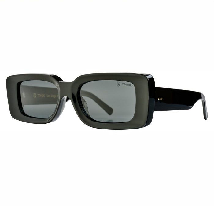  Black rectangular sunglasses with thick frames and dark lenses, shown from a side angle to display their sleek design.